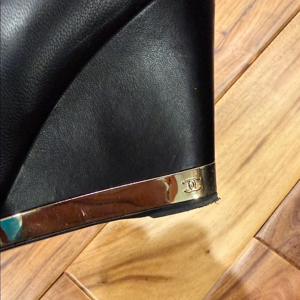 CHANEL Black Leather Wedge Boots with Gold Accent